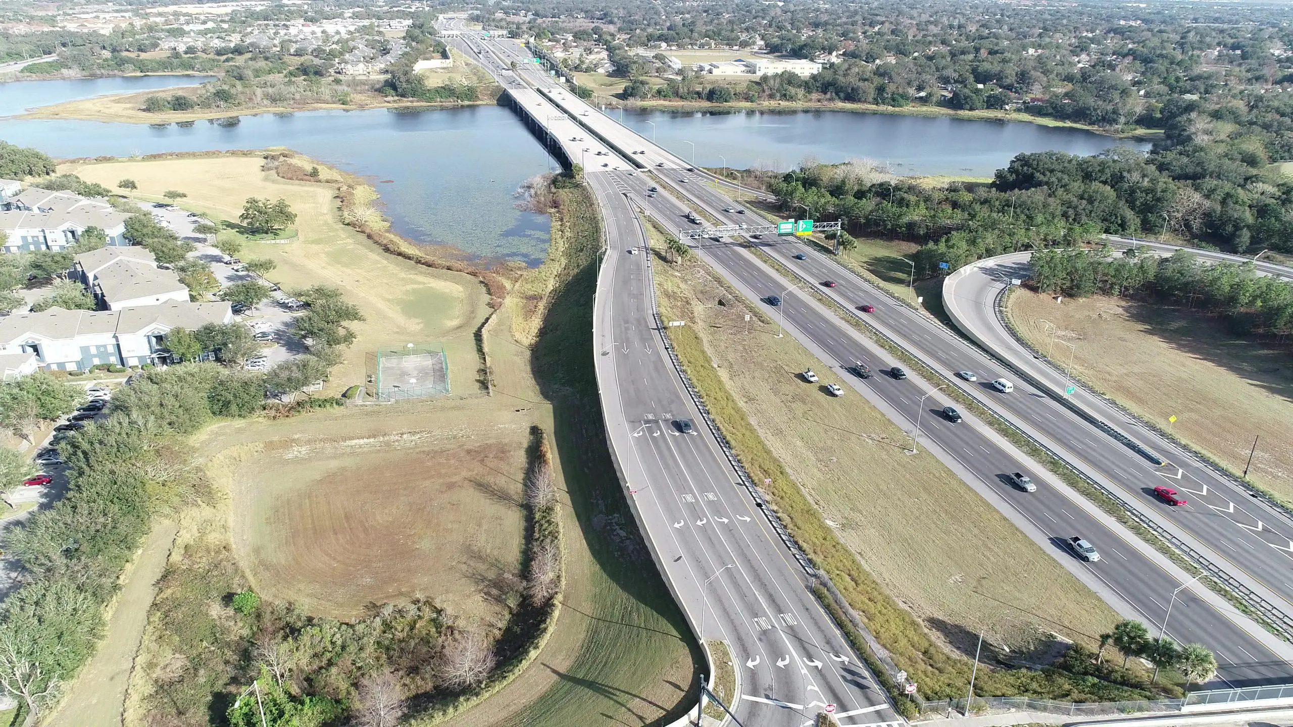 Aerial view of an expressway crossing open water in Orlando