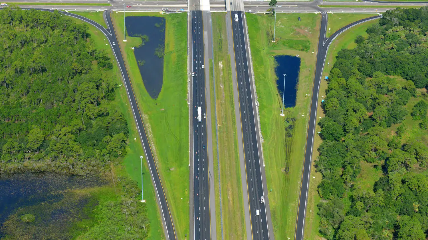 Overhead aerial view of a widened interstate corridor